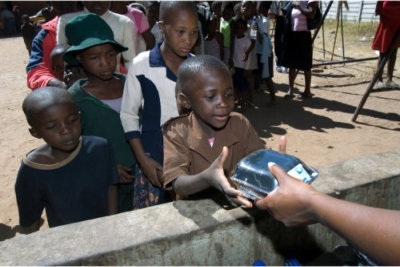 poor children falling in line for a feeding program